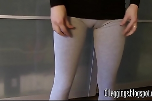 Wield cameltoe beside grey leggings.
